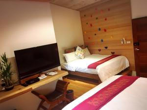 Voodi või voodid majutusasutuse Shang Shui Yun Ji B&B toas