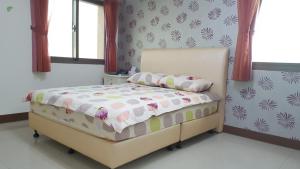Postel nebo postele na pokoji v ubytování Da Yi Train Homestay