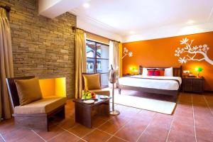Ein Bett oder Betten in einem Zimmer der Unterkunft Temple Tree Resort & Spa