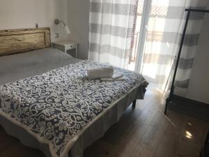 Postel nebo postele na pokoji v ubytování Il Torrione