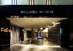a view of a building with a sign on it at Village Kyoto close by Shijo Omiya station in Kyoto