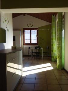 a kitchen with a table and a window at Casa Avezza in Omegna