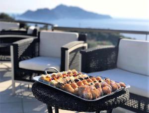 a tray of food sitting on top of a table at Villa Solaria in Massa Lubrense