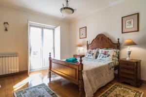 A bed or beds in a room at Tipica Casa Portuguesa