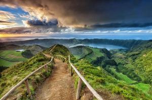 a path on top of a mountain with a sunset at Aparthotel Barracuda in Ponta Delgada