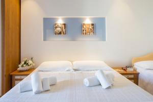 Postel nebo postele na pokoji v ubytování Hotel Pacific
