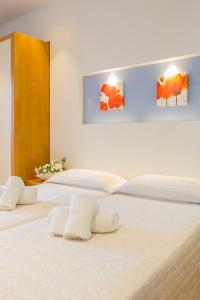 Postel nebo postele na pokoji v ubytování Hotel Pacific