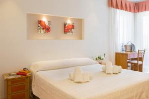 Postel nebo postele na pokoji v ubytování Hotel Pacific