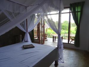 Postel nebo postele na pokoji v ubytování Nelu Villa Sigiriya