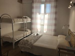 Postel nebo postele na pokoji v ubytování Il Torrione