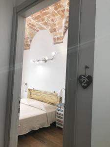 Postel nebo postele na pokoji v ubytování Il Torrione