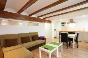 a living room with a couch and a table at Singular Apartments Station in Valencia