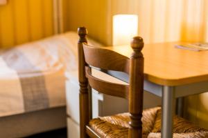 Postel nebo postele na pokoji v ubytování Arconaty Hotel