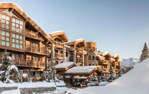 a lodge in the winter with snow on the ground at Apogée Courchevel, Oetker Hotels in Courchevel