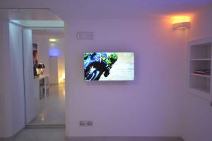 TV a/nebo společenská místnost v ubytování Golden Bay