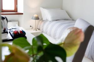 Postel nebo postele na pokoji v ubytování La Ripa Boutique Hotel