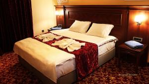 Postel nebo postele na pokoji v ubytování Artemis Resort Wellness Hotel