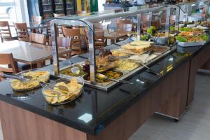 a buffet line with many different types of food at Hotel Royal in Salinas