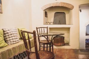 a room with a table and two chairs and a table and a tableablish at Celestia Traditional Houses in Keramoto