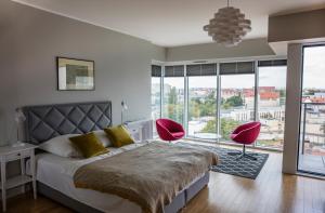 Postel nebo postele na pokoji v ubytování Apartamenty I.M.A Towarowa