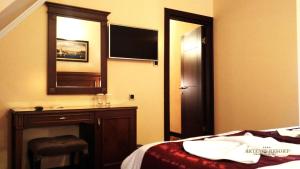 Postel nebo postele na pokoji v ubytování Artemis Resort Wellness Hotel