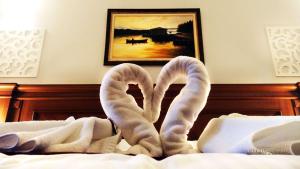 Postel nebo postele na pokoji v ubytování Artemis Resort Wellness Hotel