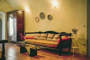 a bedroom with a bed with pillows on it at Celestia Traditional Houses in Keramoto