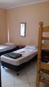 Giường trong phòng chung tại Pousada Serra e Mar RioCentro