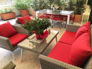 a patio with a couch and chairs and a table at La Loggia Al Duomo - Treviso in Treviso