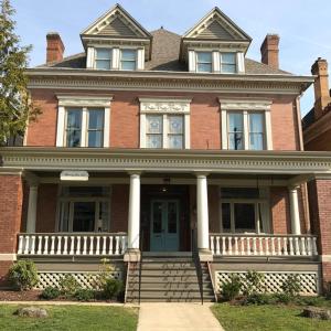 a large brick house with a porch and a door at Morning Sun Inn - Pittsburgh in Pittsburgh