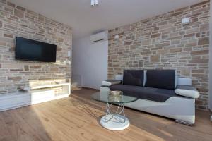 TV a/nebo společenská místnost v ubytování Villa Bareta 2