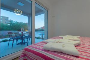 Postel nebo postele na pokoji v ubytování Villa Bareta 2