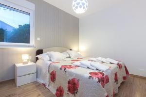 Postel nebo postele na pokoji v ubytování Villa Bareta 2