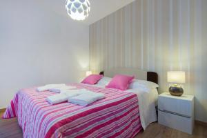 Postel nebo postele na pokoji v ubytování Villa Bareta 2