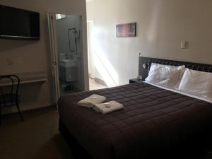 Postel nebo postele na pokoji v ubytování Motel on Carroll