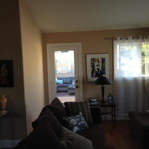 a living room with a couch and a table with a lamp at Redondo Beach / Hermosa Beach in Redondo Beach