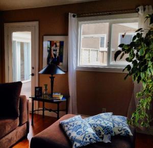 a living room with a couch and a window at Redondo Beach / Hermosa Beach in Redondo Beach