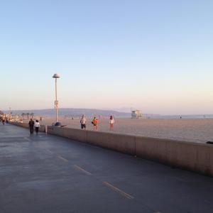 a group of people walking along the beach at Redondo Beach / Hermosa Beach in Redondo Beach