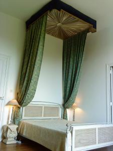 A bed or beds in a room at Château de Gerbe