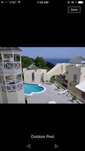 a picture of a house with a swimming pool at Columbus Heights A5 in Ocho Rios