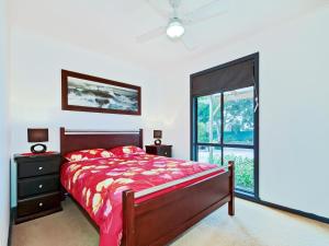 a bedroom with a bed and a large window at Sea Devine - Port Willunga - C21 SouthCoast Holidays in Port Willunga