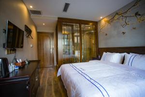 Katil atau katil-katil dalam bilik di Wang Jiang Reclusive Boutique Inn