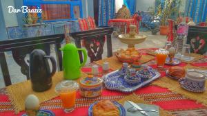 a table with food and drinks on top of it at Dar Baaziz in Sousse