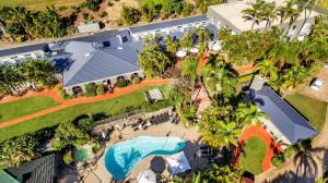 an aerial view of a house with a swimming pool at Korora Bay Village Resort in Coffs Harbour