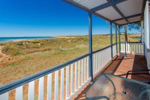 a balcony of a house with a view of the ocean at Discovery Parks - Port Hedland in Port Hedland