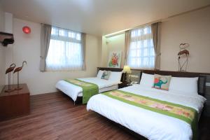 Rúm í herbergi á Yilan Ya Lu Homestay
