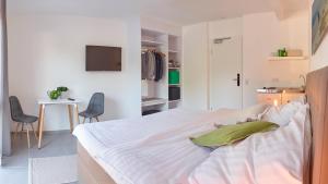 Katil atau katil-katil dalam bilik di City Hotel ApartW3 - kostenlos parken