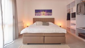 Katil atau katil-katil dalam bilik di City Hotel ApartW3 - kostenlos parken