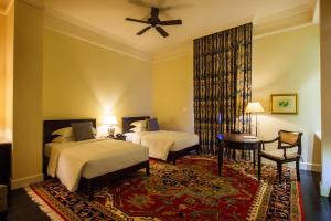 Voodi või voodid majutusasutuse Galle Face Hotel toas