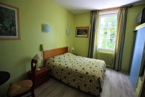 Postel nebo postele na pokoji v ubytování Hôtel La Caravelle